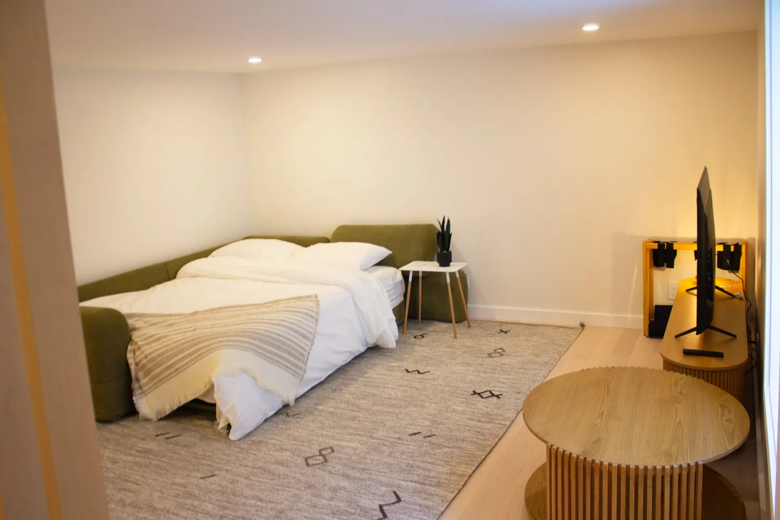 The lower-level sofa opens into a bed with queen sheets