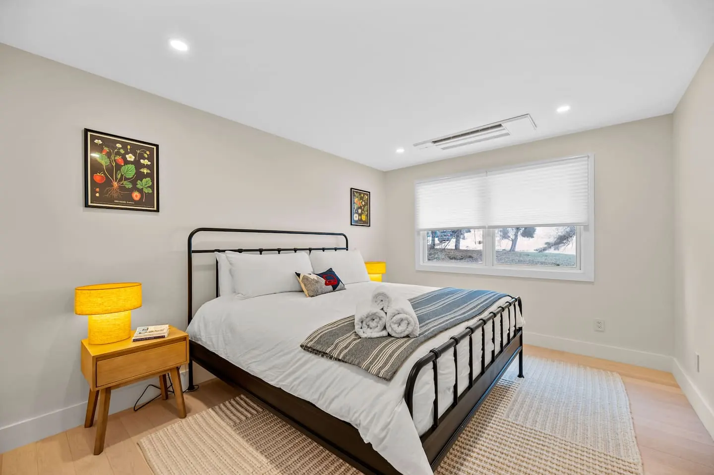 Bedroom 3 with a king bed and black metal frame