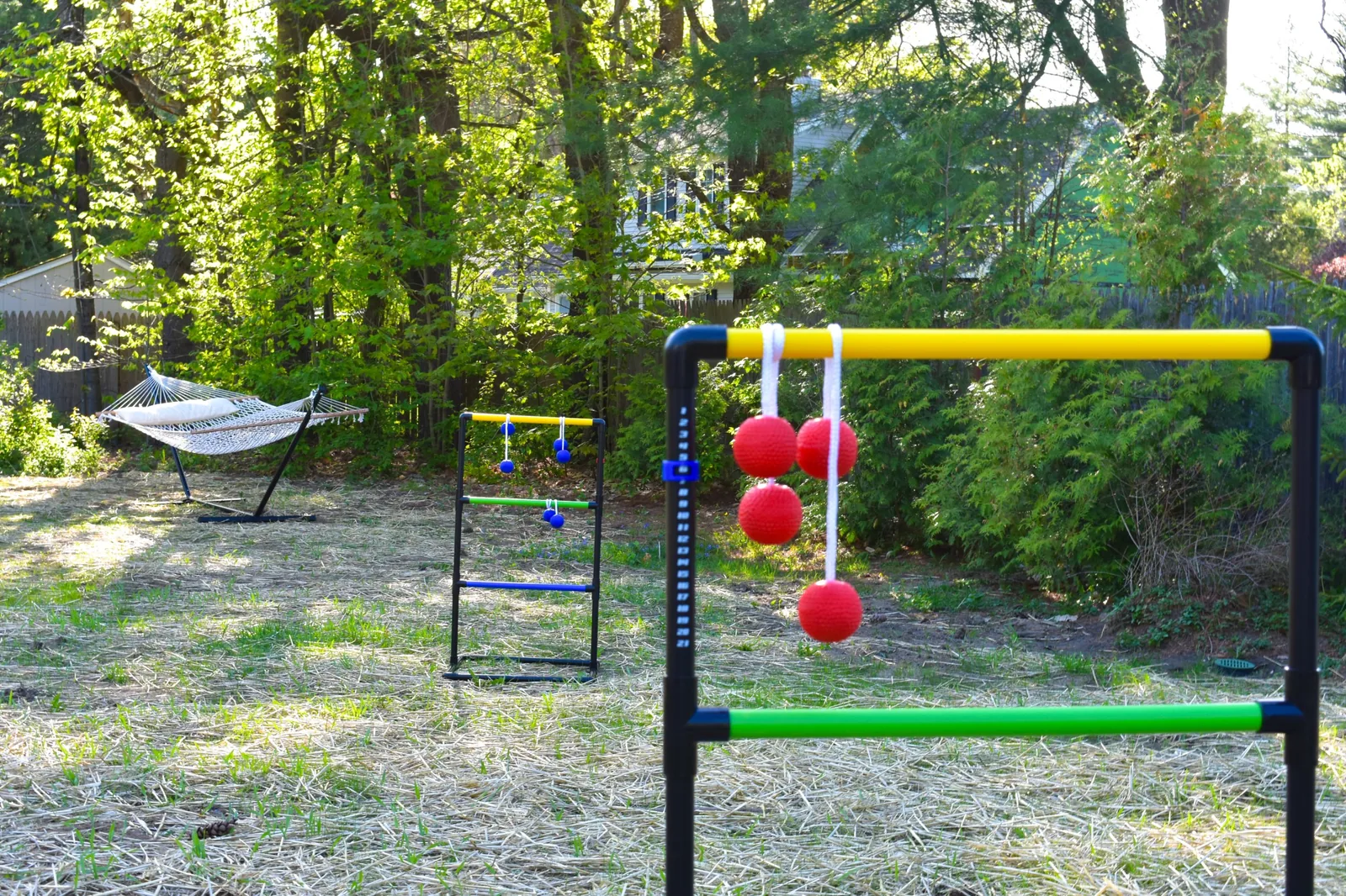 Ladder golf set on the lawn with a hammock behind