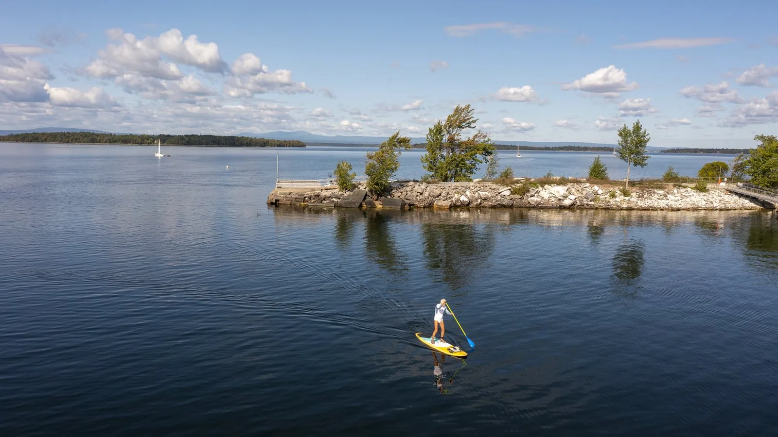 Paddleboarder on Lake Champlain, one of Vermont's many lakes