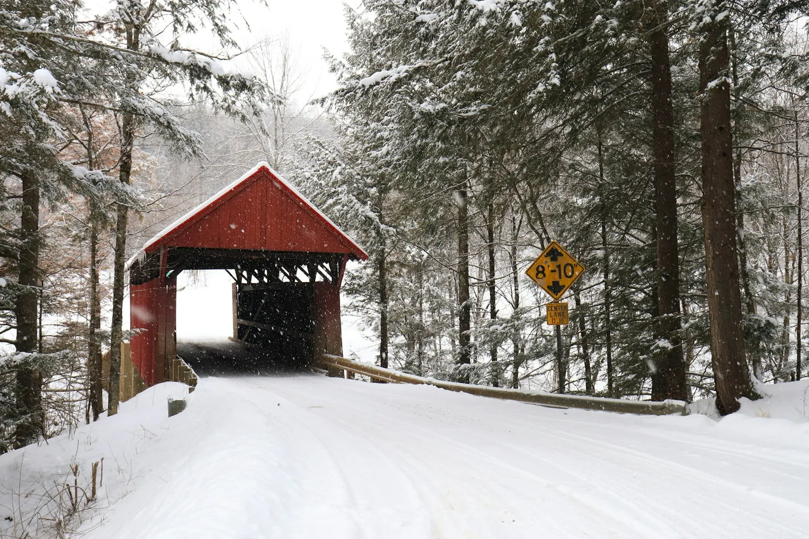 Red covered bridge in fresh snow, Vermont